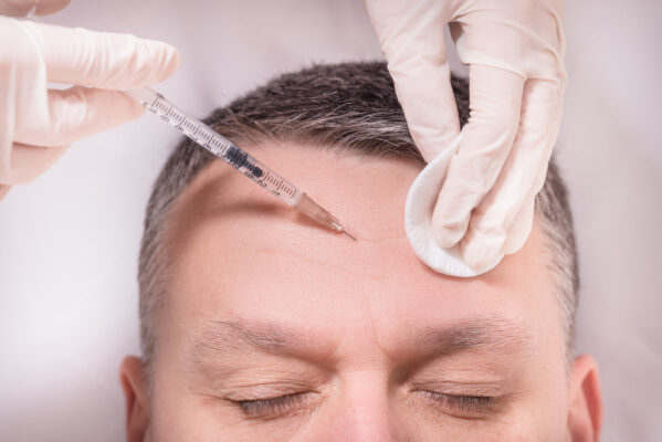 Man beauty procedure anti-wrinkle botox injections